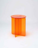 Designer side table crafted from polished acrylic with a sculptural round silhouette. A contemporary accent table that brings vibrant colour to luxury interiors.