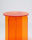 Designer acrylic side table showcasing bold colour and precision craftsmanship. Crafted as a functional statement piece for contemporary interiors.
