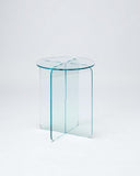 Sculptural coloured acrylic side table featuring a refined round tabletop and intersecting base. Crafted for architects, interior designers and luxury residential interiors.