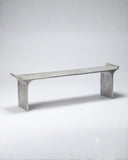 Sculptural bench featuring a textured metallic finish and elegant curved edges. A designer bench crafted for contemporary luxury interiors.