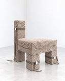 Richard Yasmine Size Matters Lounge Chair featuring a low, angular silhouette with textured neutral upholstery and distinctive block-like sections. Its exaggerated proportions and sculptural construction create a contemporary statement in relaxed seating.