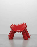 Sculptural designer chair featuring bold contemporary forms and refined craftsmanship. Created as a statement seating piece for luxury modern interiors.