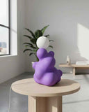 Contemporary table lamp showcasing artistic styling and clean sculptural lines. Designed as a statement lighting piece for sophisticated residential spaces.