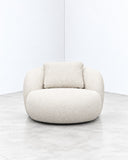 B15Z Maxi lounge chair featuring an oversized rounded upholstered seat and enveloping backrest in textured ivory fabric. The generous proportions create a contemporary accent chair with a soft, sculptural profile.