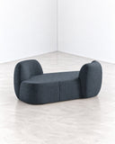 SECOLO Sofa featuring a low, rounded silhouette with a generously upholstered seat and sculptural curved backrests at both ends. Its compact, organic form brings a contemporary accent to refined residential and hospitality interiors.