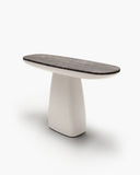 Contemporary HERA X console with a slim dark stone top and sculptural light-toned pedestal base. Its contrasting materials and organic proportions create an elegant statement piece for modern interiors.