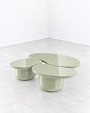 SECOLO Laghi Mirrored Coffee Table with overlapping rounded surfaces and sculptural cylindrical bases in a soft muted finish. Its playful, organic geometry creates a distinctive contemporary focal point.