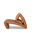 Sculptural leather lounge chair featuring soft organic curves and premium Swiss craftsmanship. A designer armchair created for contemporary luxury interiors.