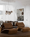 Contemporary leather lounge chair with an inviting sculptural form and soft upholstery. A luxury seating piece that blends Swiss craftsmanship with modern design.