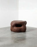 Sculptural coffee table with a handcrafted textured finish. A collectible design piece inspired by organic geological forms.
