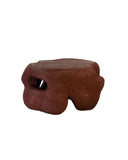 Sculptural centre table with carved architectural openings. A contemporary furniture piece with collectible design appeal.