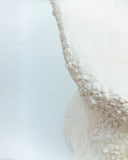 Contemporary designer chair with an organic sculptural profile. Crafted as a functional work of art.