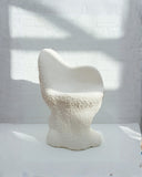 Handcrafted lounge chair inspired by natural forms and textures. Designed for contemporary collectible interiors.