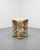Sculptural three leg stool featuring handcrafted carved detailing. A designer seating piece inspired by organic contemporary forms.