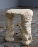 Sculptural wooden stool with an expressive handcrafted silhouette. A collectible seating piece for contemporary living spaces.