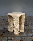 Luxury stool featuring a solid timber seat and carved sculptural base. Designed to bring artistic character to interiors.