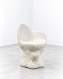 Tellurico A Chair for Ursula Limited Edition Armchair featuring an enveloping curved backrest, rounded seat, and sculptural pedestal-like base in a textured ivory finish. Its fluid silhouette and tactile surface blur the line between functional seating and collectible design.