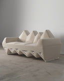 Lighting Sofa showcasing angular backrest forms, white upholstery and a sculptural geometric base. Designed as a distinctive contemporary sofa for sophisticated interiors.