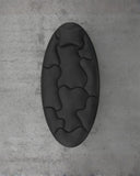 Top view of the Off Balance Daybed highlighting its organic upholstered sections and elongated oval silhouette. The sculptural form creates a distinctive statement for modern interiors.