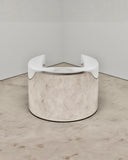 Pill Chair featuring a cylindrical sculptural form with polished reflective metal surfaces. A distinctive contemporary designer chair for luxury modern interiors.