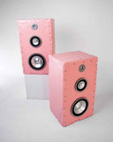 Sculptural Brutalist speaker crafted with a textured pink finish and bold monolithic form. The handcrafted audio piece combines collectible design with high-performance sound for contemporary interiors.
