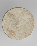 Round stone surface with natural patterns on a gray background