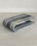Marble-patterned bench on a light gray background