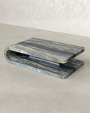 Marble-patterned coffee table on a neutral background