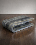 Marble-patterned coffee table on a wooden floor with a neutral background