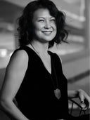 Black and white portrait of our designer Noemi Saga with a blurred background