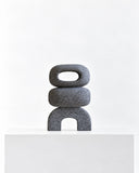 LS-05 volcanic rock sculpture featuring a rounded rectangular opening above a curved base, with a coarse porous surface. The minimalist stacked geometry showcases the raw texture of natural volcanic stone.