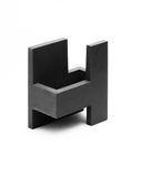 Side view of the concrete sculpture highlighting the balance of forms