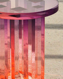 Close up of faceted acrylic leg transitioning from crimson to amber orange
