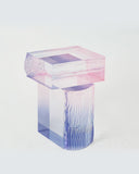 Translucent pink and blue rectangular object on a white background