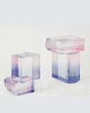 Contemporary raw crystal furniture piece standing on white background