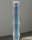 190cm tall blue and white art sculpture standing in a gallery space
