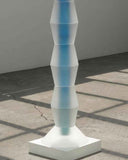 Close up of the rhythmic curves and matte finish of the resin totem