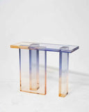 Rectangular acrylic console table fading from lavender blue to amber orange
