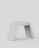 Minimalist white stool on a light gray background